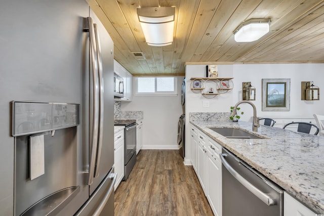 kitchen with sink, white cabinetry, wood ceiling, stainless steel appliances, and light stone countertops