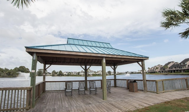 dock area with a gazebo and a water view