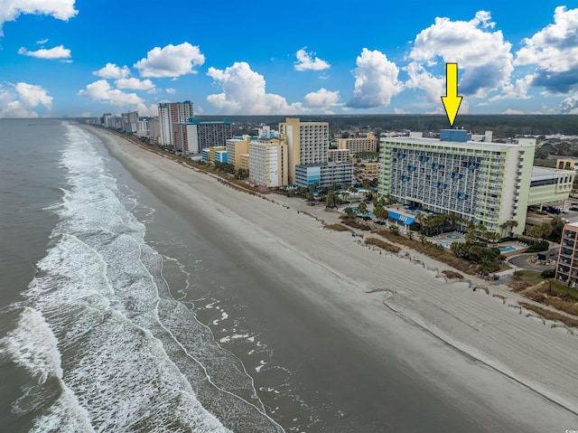 drone / aerial view with a beach view and a water view