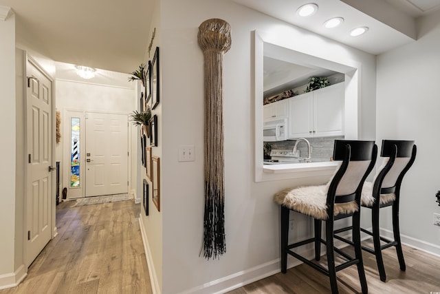 hallway featuring light hardwood / wood-style flooring