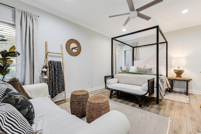 bedroom featuring crown molding, hardwood / wood-style floors, and ceiling fan