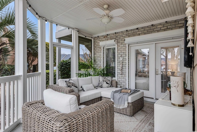 sunroom with french doors and ceiling fan