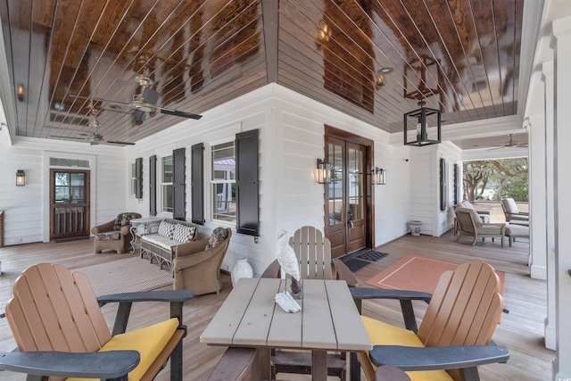 exterior space featuring ceiling fan, french doors, and an outdoor living space