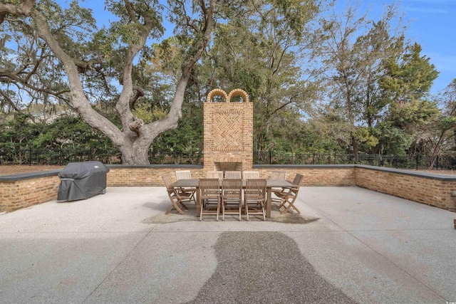 view of patio featuring a grill and outdoor dining space