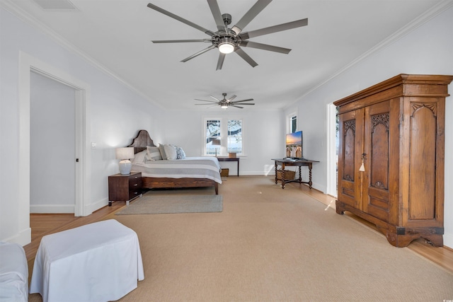 bedroom with baseboards, a ceiling fan, and crown molding