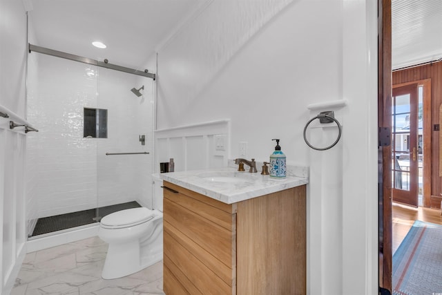 bathroom with toilet, marble finish floor, a shower stall, and vanity