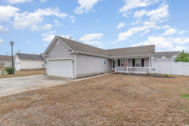 ranch-style house with a garage and covered porch