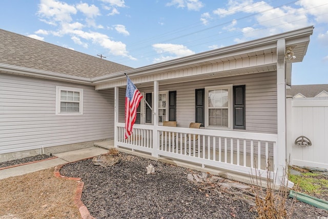 view of exterior entry featuring a porch