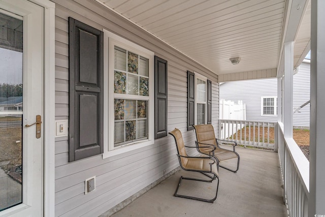 balcony featuring a porch