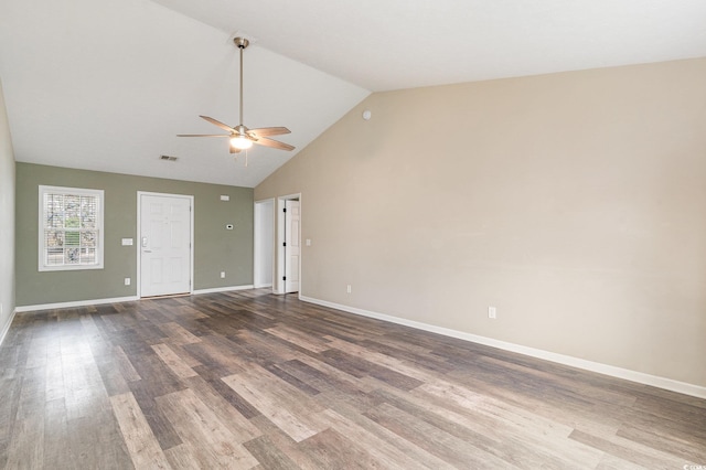 unfurnished room featuring high vaulted ceiling, dark wood-type flooring, and ceiling fan