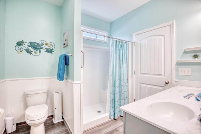 bathroom with vanity, toilet, a shower with shower curtain, and hardwood / wood-style floors