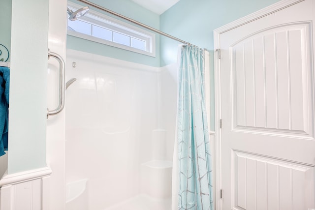 bathroom featuring a shower with curtain