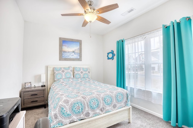 carpeted bedroom with ceiling fan