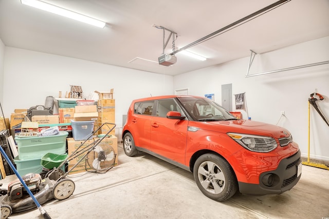 garage featuring a garage door opener and electric panel