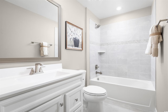 bathroom with tub / shower combination, vanity, and toilet