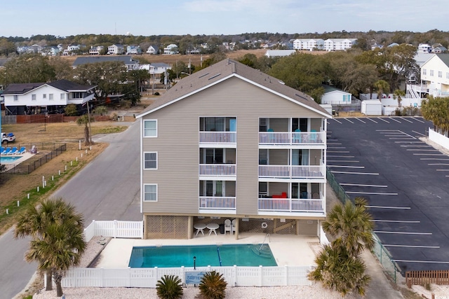 exterior space with a fenced in pool