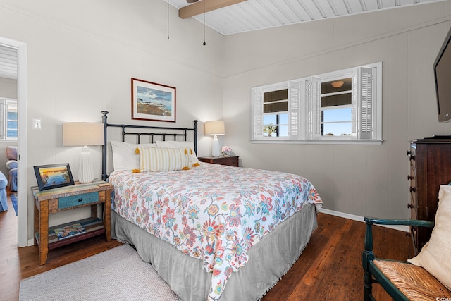 bedroom with dark wood-type flooring