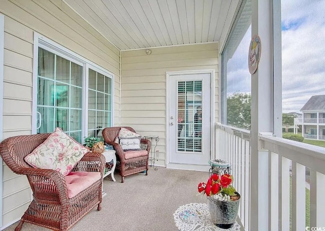 sunroom with wooden ceiling