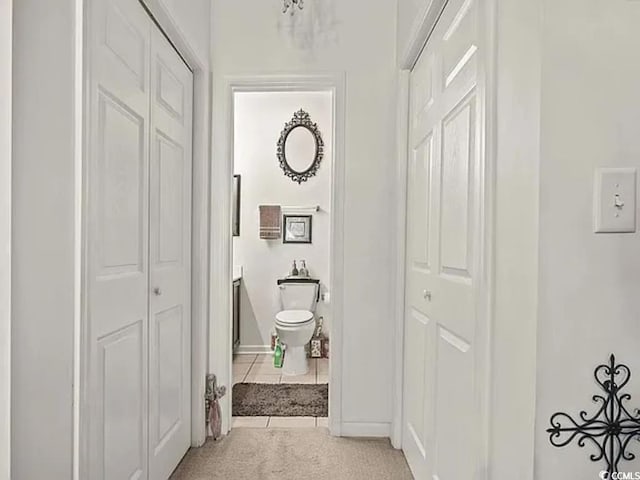 bathroom with tile patterned floors and toilet