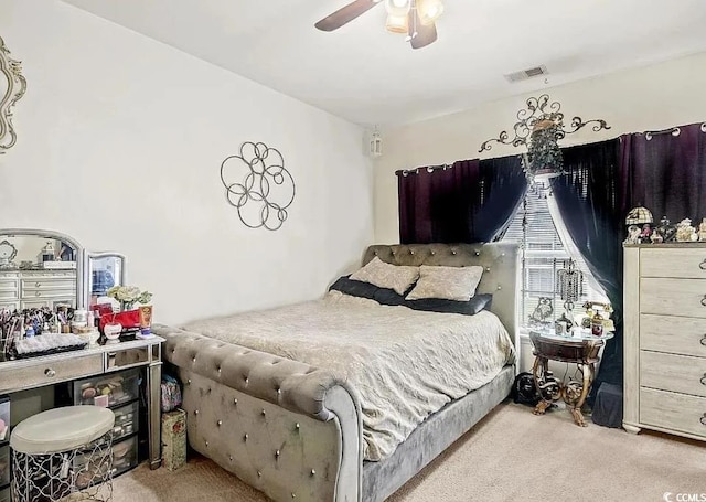 bedroom with light colored carpet and ceiling fan