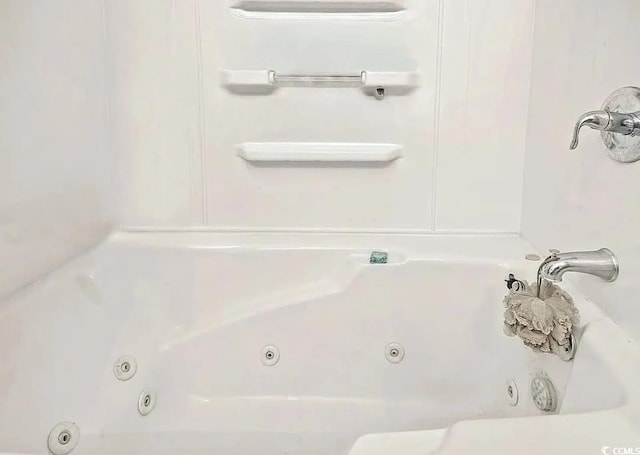 bathroom with a tub