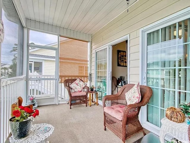 sunroom / solarium featuring wooden ceiling