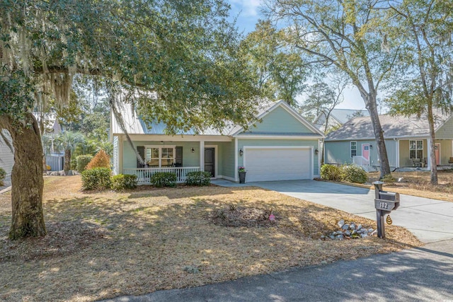 single story home with a garage and covered porch