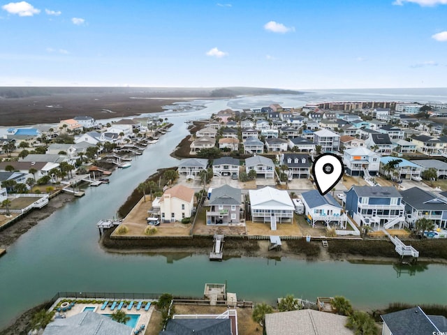 bird's eye view with a residential view and a water view