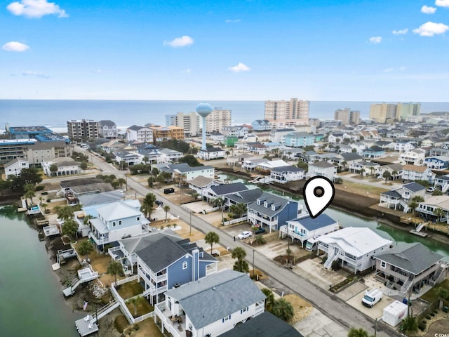 aerial view featuring a city view and a water view