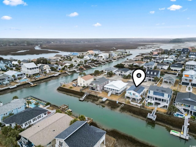 birds eye view of property featuring a water view and a residential view