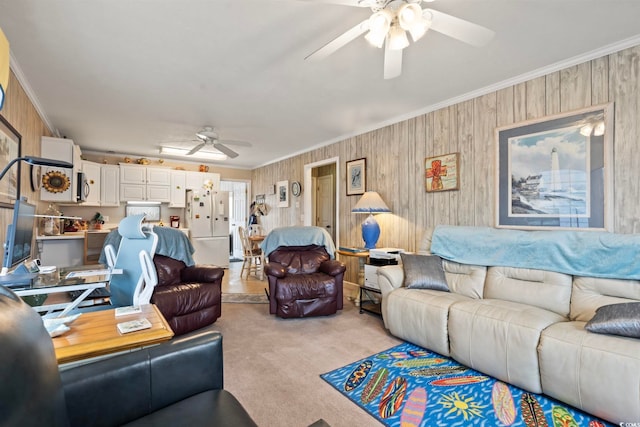 315 60th Ave N, North Myrtle Beach, SC 29582 - living area featuring ceiling fan, ornamental molding, light colored carpet, and wood walls