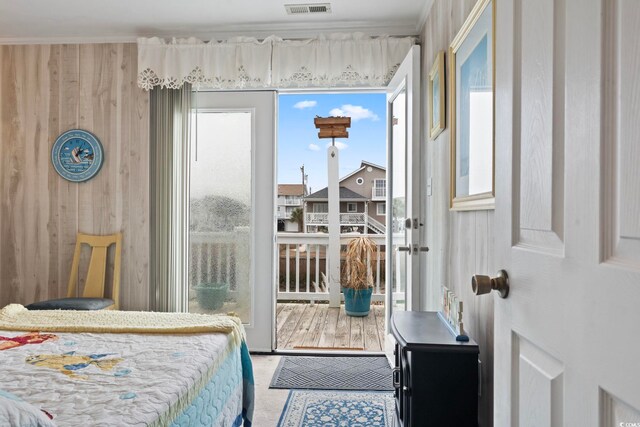 315 60th Ave N, North Myrtle Beach, SC 29582 - bedroom featuring ornamental molding and wooden walls