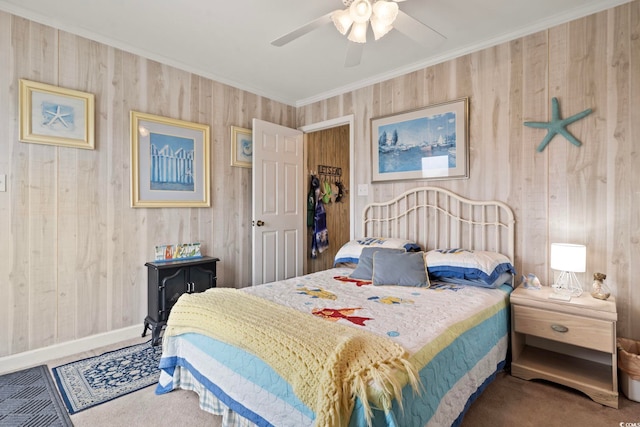 bedroom with wooden walls, ornamental molding, and carpet floors