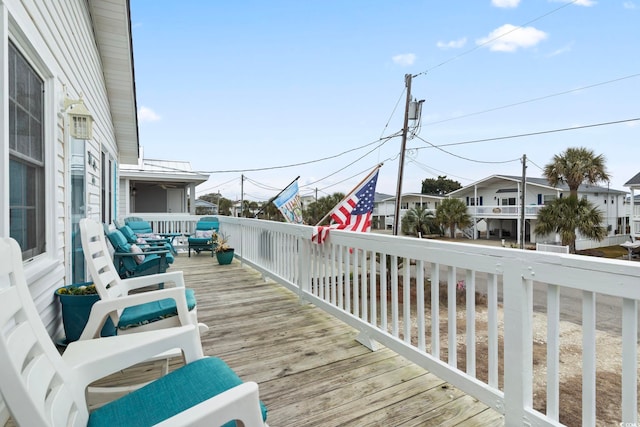 wooden deck with a residential view