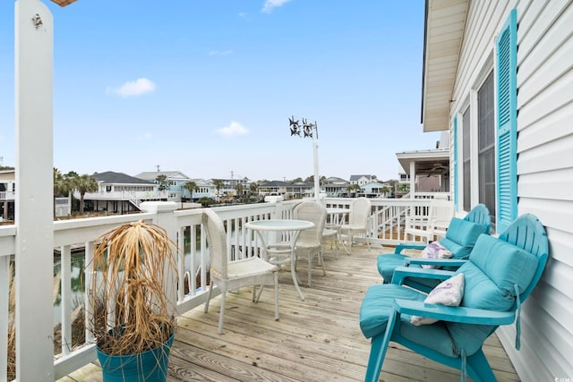 wooden deck with a residential view