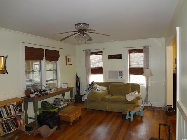 living room featuring cooling unit, ornamental molding, dark hardwood / wood-style floors, and ceiling fan