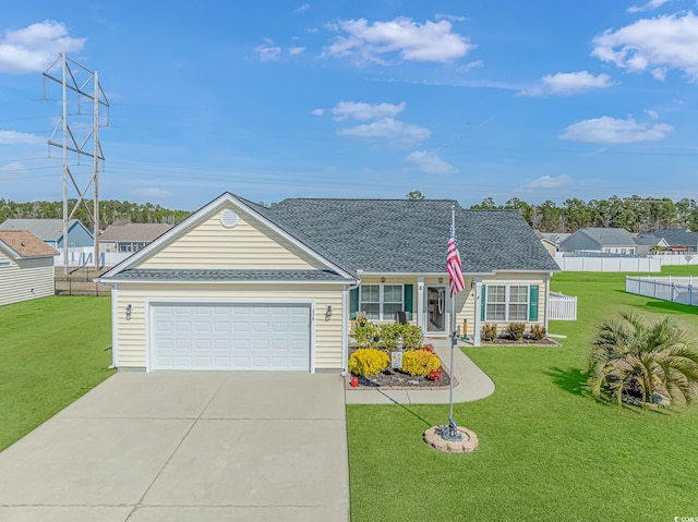 ranch-style home featuring driveway, a garage, roof with shingles, fence, and a front yard