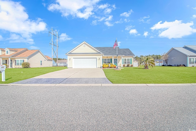 view of front of house featuring a garage, concrete driveway, a front yard, and a residential view