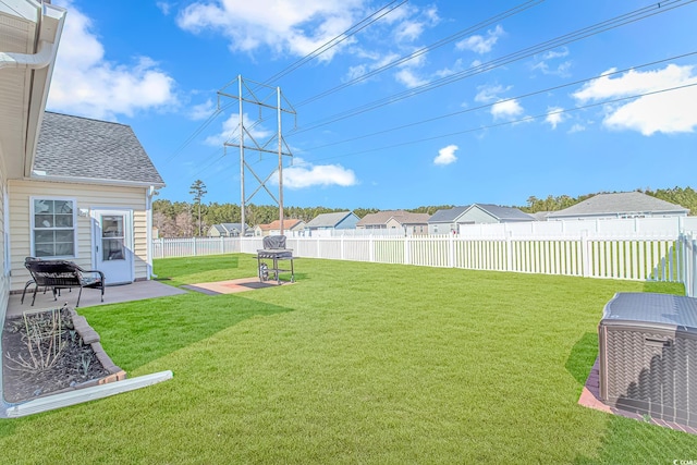 view of yard featuring a patio area and a fenced backyard