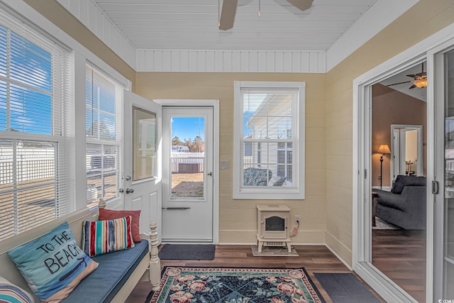 sunroom with a ceiling fan