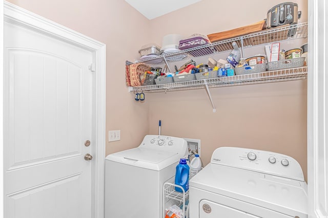 washroom featuring laundry area and washer and dryer