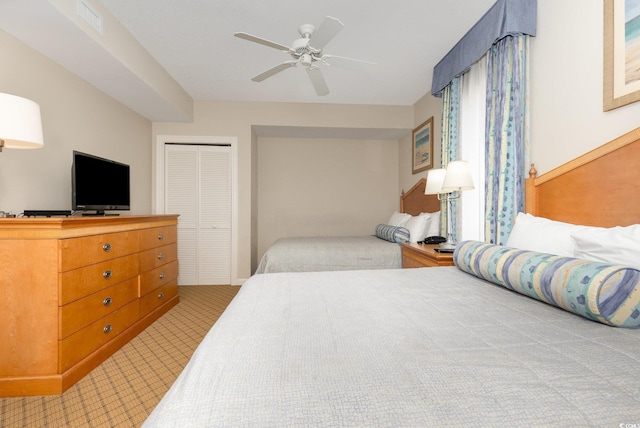 9994 Beach Club Dr Unit 1601, Myrtle Beach, SC 29572 - bedroom with light colored carpet, a closet, and a ceiling fan