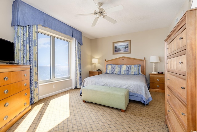 9994 Beach Club Dr Unit 1601, Myrtle Beach, SC 29572 - bedroom featuring light carpet, baseboards, and ceiling fan