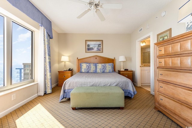 9994 Beach Club Dr Unit 1601, Myrtle Beach, SC 29572 - bedroom featuring baseboards, ensuite bathroom, light colored carpet, and ceiling fan