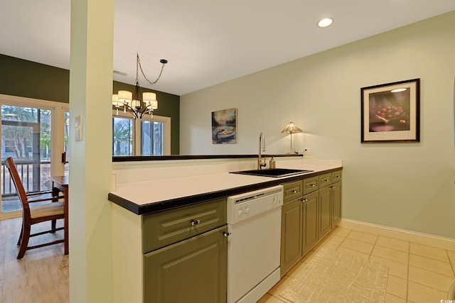 kitchen with an inviting chandelier, sink, light tile patterned flooring, dishwasher, and decorative light fixtures