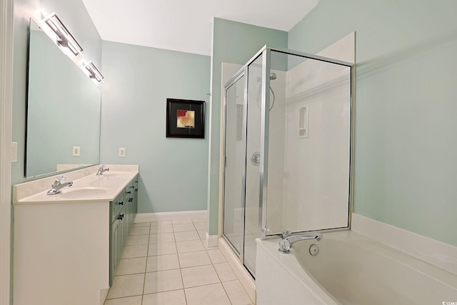 bathroom with plus walk in shower, vanity, and tile patterned floors