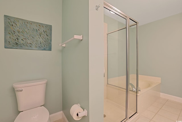 bathroom featuring separate shower and tub, tile patterned flooring, and toilet