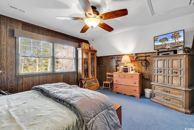1800 Glenns Bay Rd, Surfside Beach, SC 29575 - carpeted bedroom featuring lofted ceiling, a textured ceiling, and wood walls