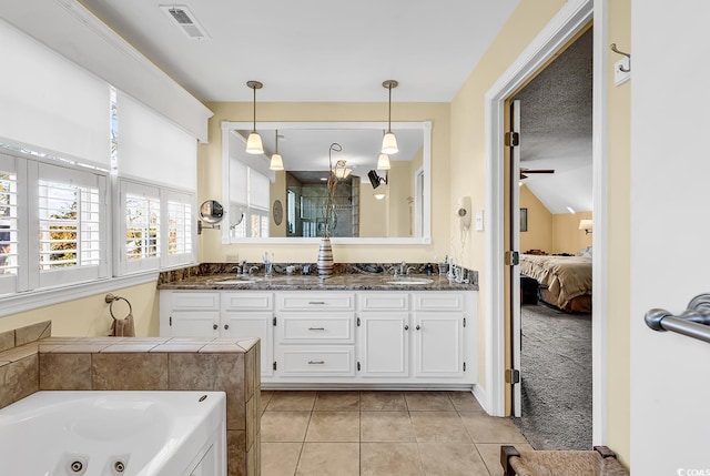 1800 Glenns Bay Rd, Surfside Beach, SC 29575 - bathroom with vaulted ceiling, vanity, shower with separate bathtub, and tile patterned flooring