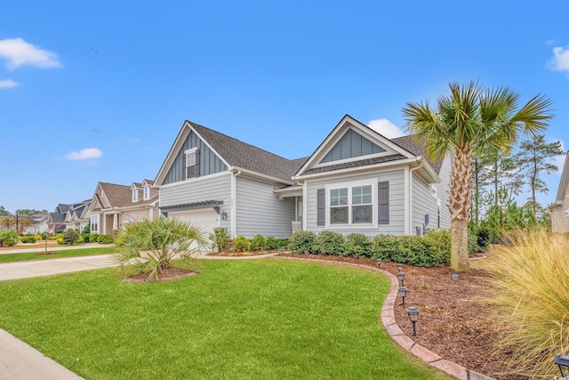 view of front of house with a garage and a front yard